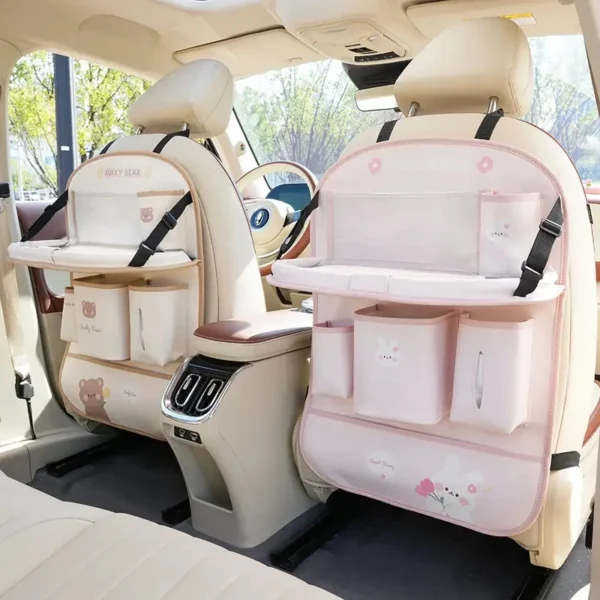 Leather seat back organizer with foldable dining tray mounted behind a car front seat