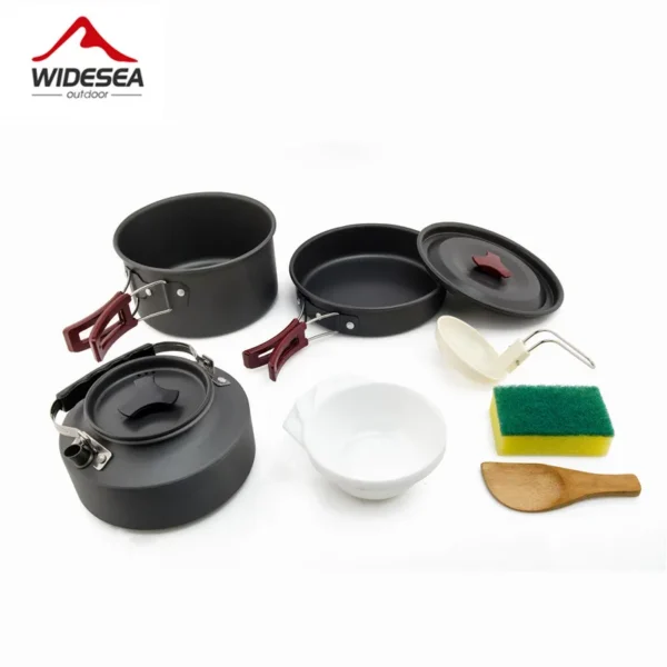 Camping pot tableware kit with nesting aluminum pots and kettle laid out on a camp table