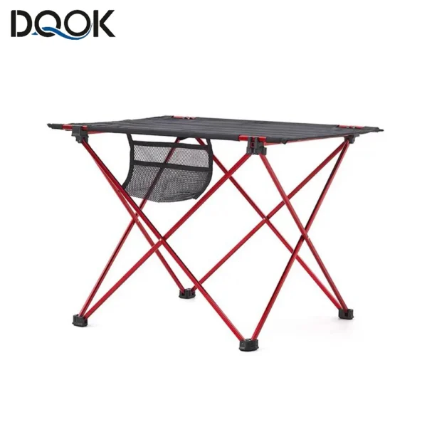6061 aluminum folding table with rectangular top set up at a campsite for a group meal