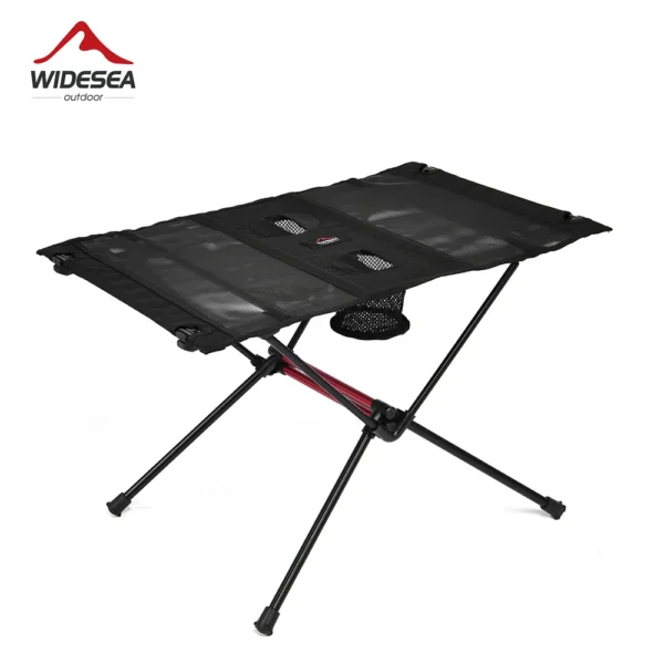 Folding travel picnic table set up outdoors with legs opened and ready for a camp meal