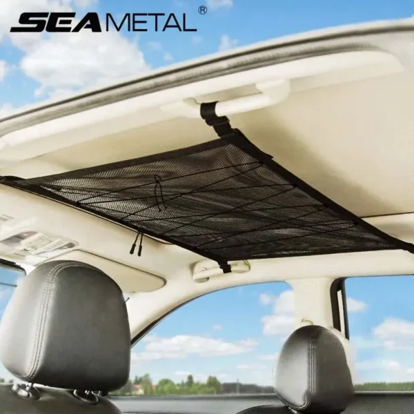 Polyester mesh car ceiling storage net strapped to roof handles holding jackets and pillows