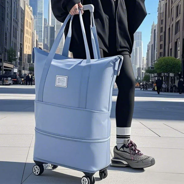Black wheeled handheld travel bag with three layers and universal wheels