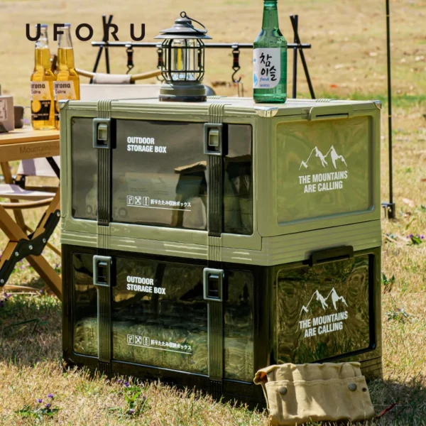 Stackable folding storage box with lid in beige stacked with camping gear in a car trunk