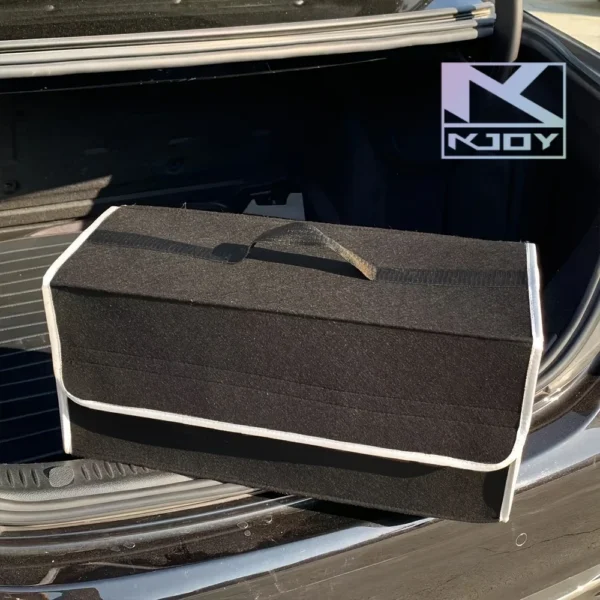 anti slip trunk storage bag in gray with compartments holding boots and shopping in a SUV trunk