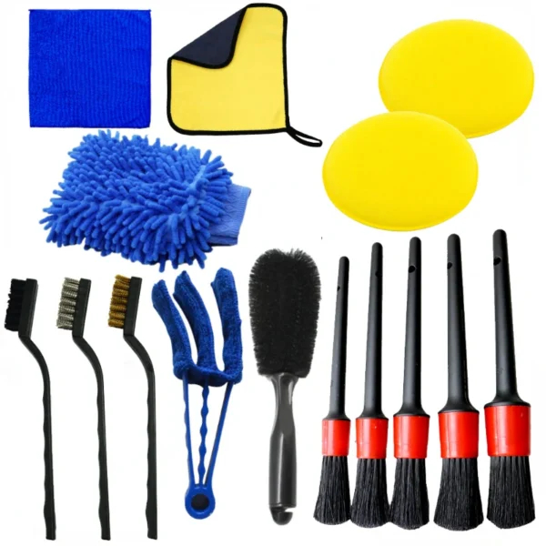 Car detailing brush set cleaning dust from a dashboard air vent inside a car
