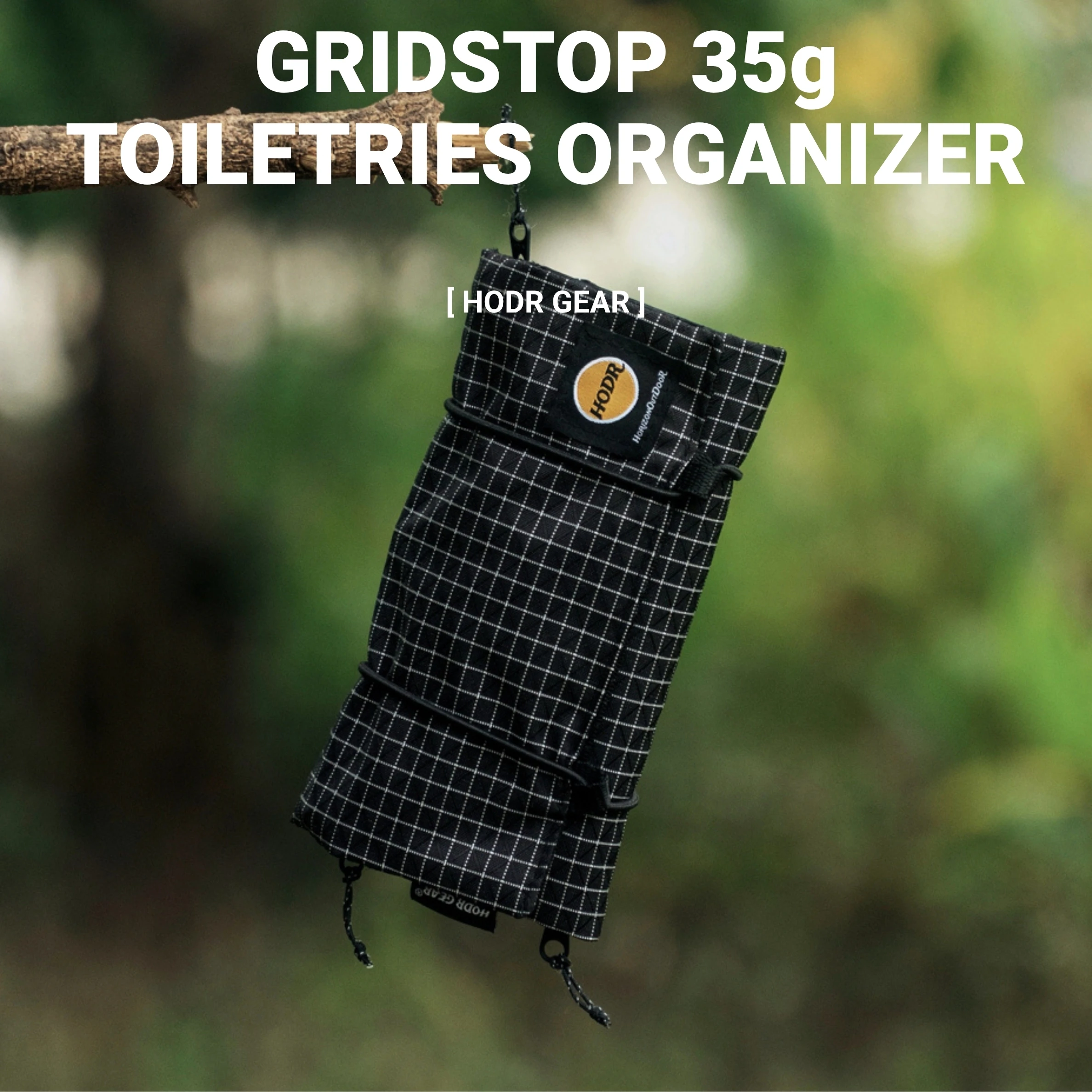 Ultralight Toiletry Organizer 35g UHMWPE Gridstop HODRGEAR 1 White ultralight toiletry organizer hanging from a branch with three mesh zones holding toiletries