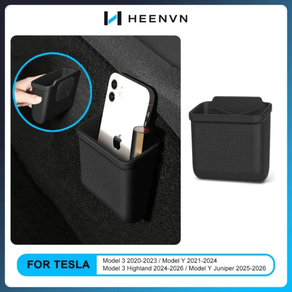 Silicone armrest storage box installed as a tray in a Tesla center armrest compartment