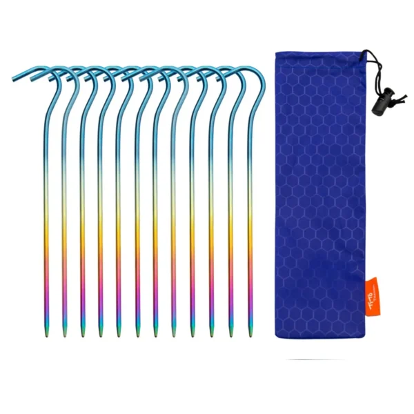 Ultralight titanium tent stakes with hook heads fanned out next to a small hiking tent
