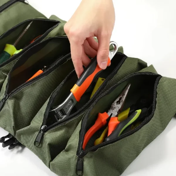 Green six pocket tool roll unrolled to show screwdrivers, pliers and wrenches in pockets