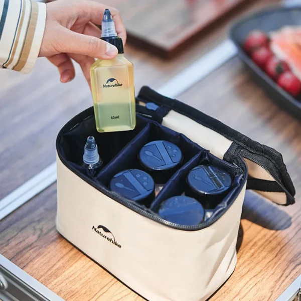 Camping spice jar set with plastic seasoning bottles arranged inside an open canvas case