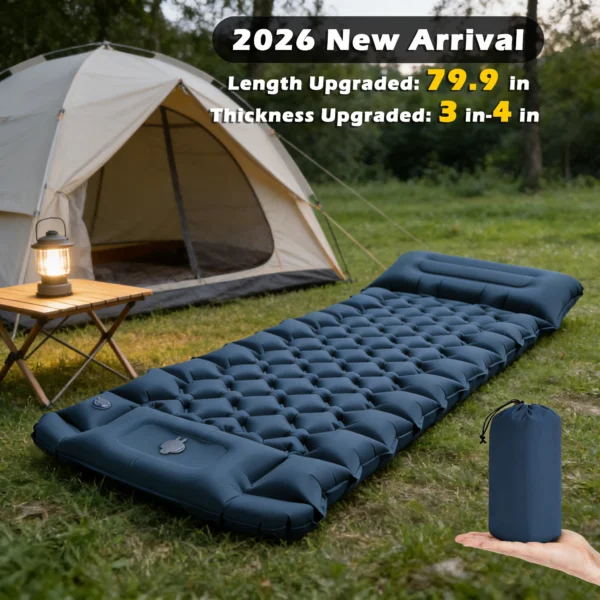 Thick inflatable camping mattress in army green with built-in pillow laid out in a tent