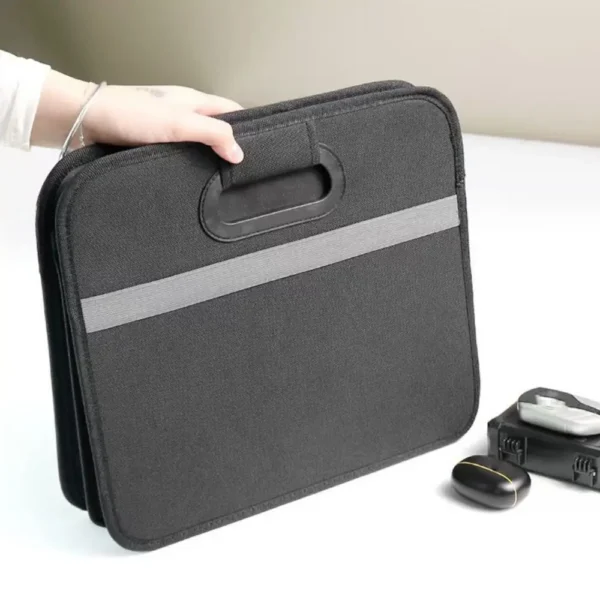Collapsible car boot organizer in black Oxford fabric filled with groceries in a car trunk