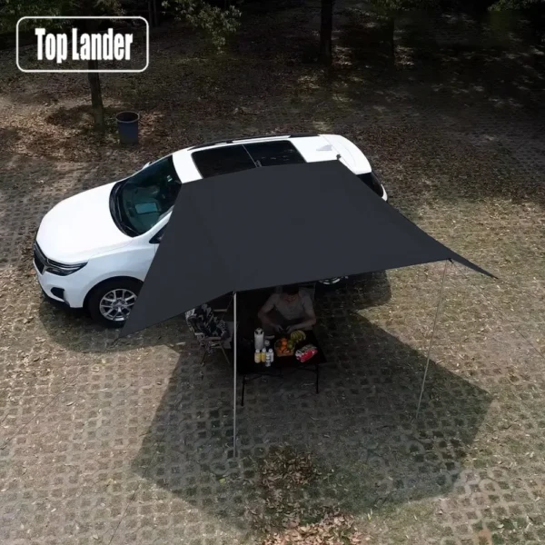 Manta ray car awning in white with black coated underside mounted by suction cups to an SUV