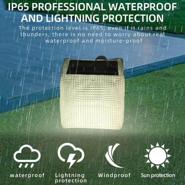 Solar inflatable lantern glowing on a camp table with the flat folded version beside it