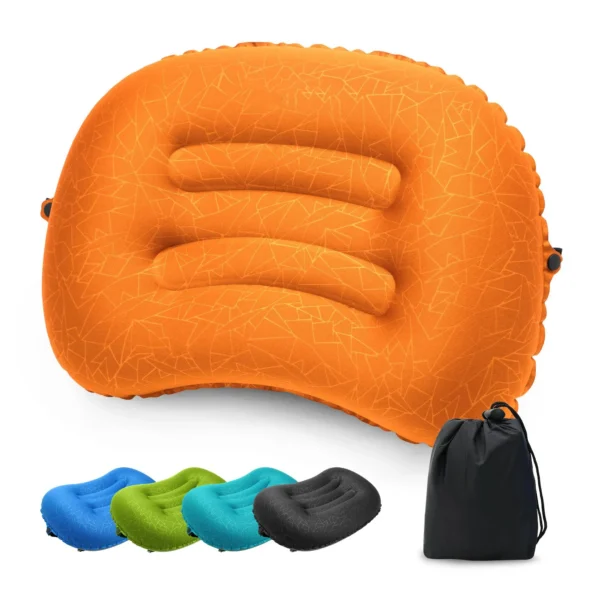 Compact inflatable camp pillow in orange next to its tiny packed size on a sleeping mat