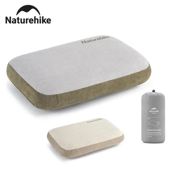 Square memory foam camping pillow in summer sand on a camp bed inside a tent