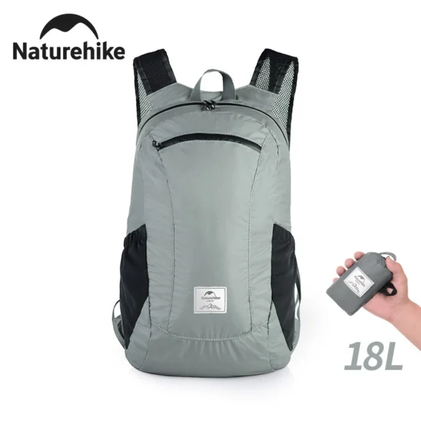 18L waterproof folding backpack in black nylon shown open and ready for a day trip
