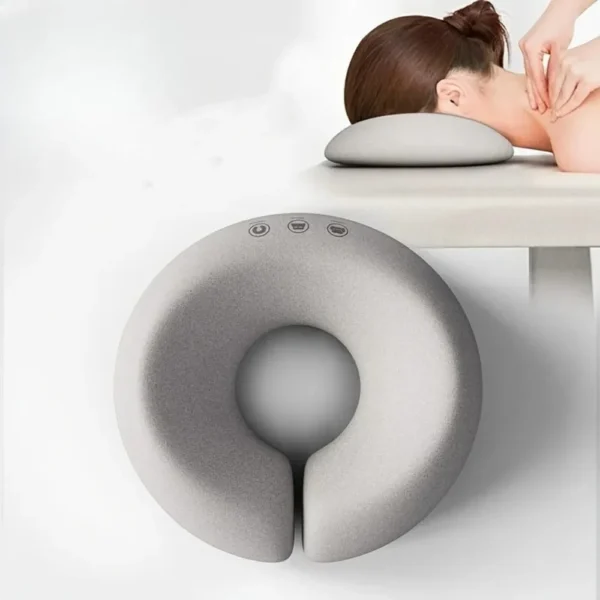 Contour face pillow in gray memory foam with zipper cover resting on a bed
