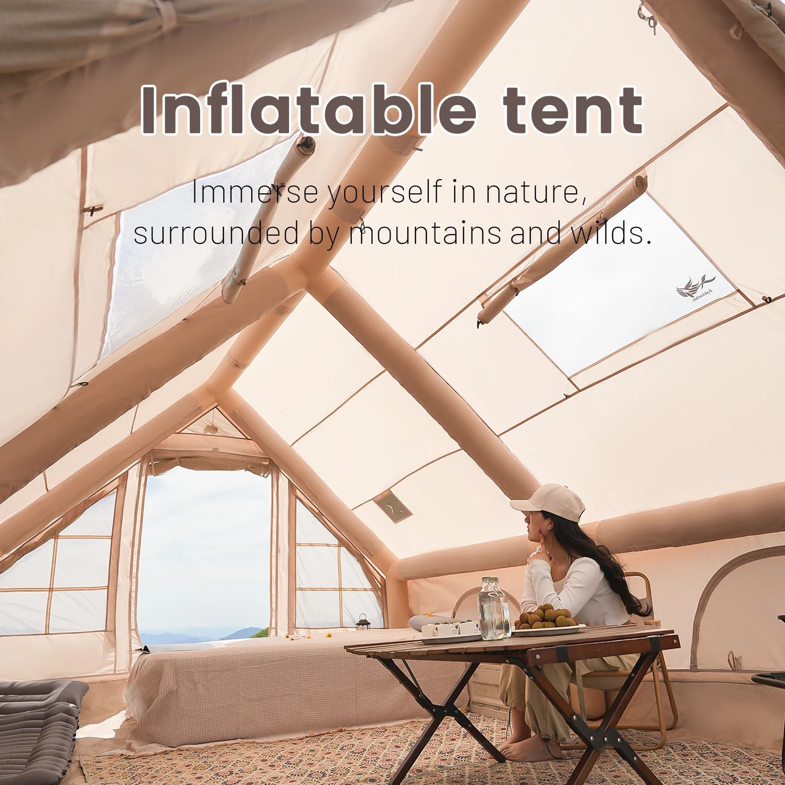 Inflatable Camping Tent with Skylight and Air Pump for 4-6 People 1 Inflatable camping tent in khaki with clear skylight pitched on grass at a family campsite