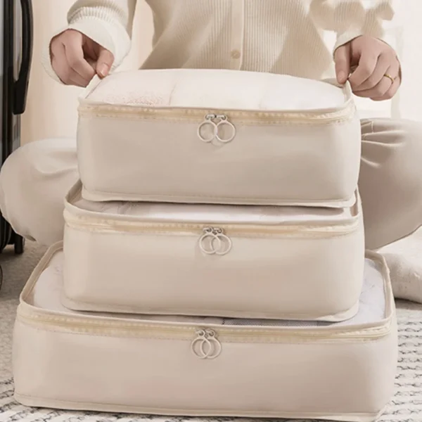 Foldable clothing storage bags 3 piece set, shown packed with clothes and folded flat
