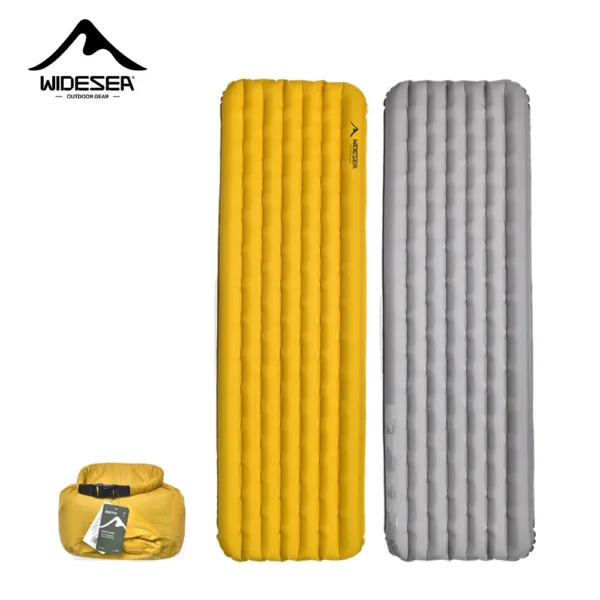 Cold weather sleeping pad 10 cm thick inflated inside a tent with snow outside and its storage bag