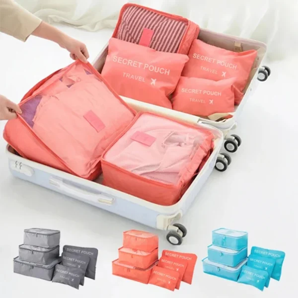 Oxford packing cube set of six rectangular zip bags in graduated sizes laid out side by side