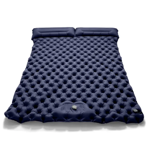 Double inflatable sleeping pad in navy blue laid out flat inside a camping tent