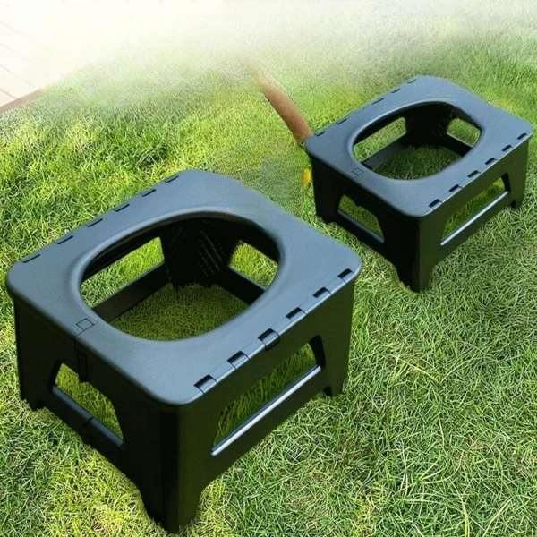 Portable camping toilet in grey shown in compact size ready for a campsite or vehicle