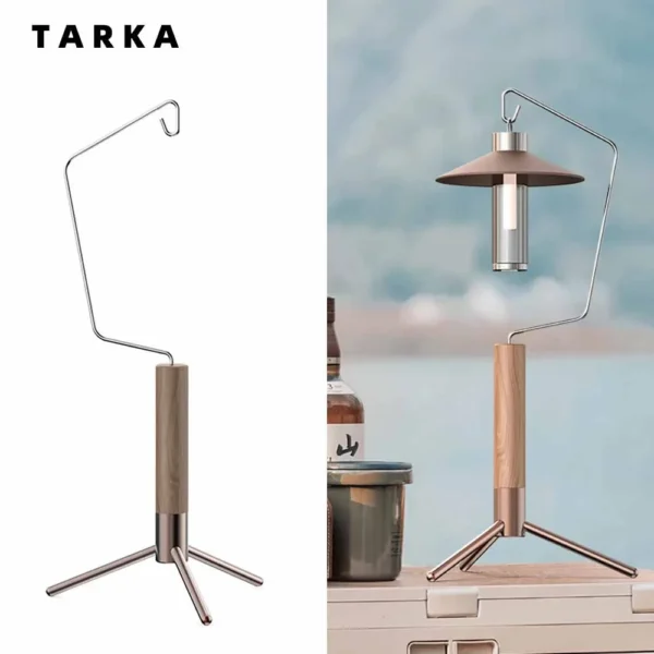 Walnut lantern stand with stainless steel bracket holding a lantern above a camp table