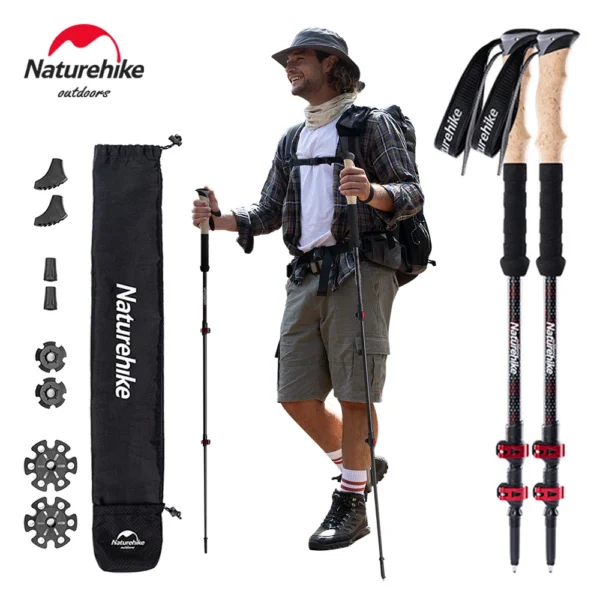 Carbon fiber trekking poles pair with cork grips, red flip locks and snow baskets