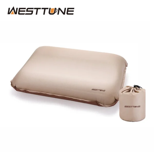 Self inflating camping pillow in khaki with 3D sponge core on a sleeping pad in a tent