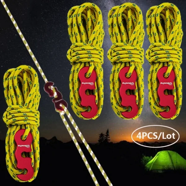 Reflective canopy ropes in yellow tensioned from a camping canopy to stakes at dusk