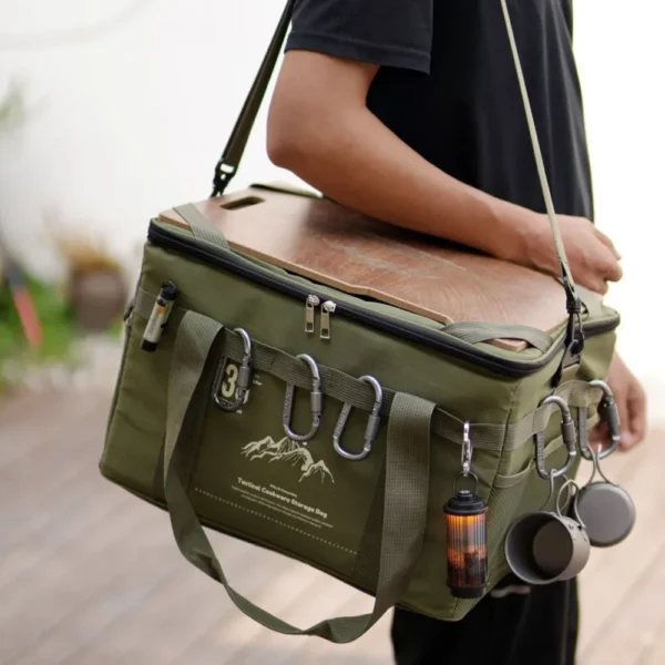 Tactical picnic bag in green 600D polyester packed with food and tableware for a camping trip