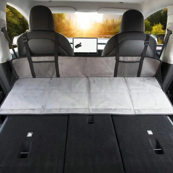 Car bed extender mattress set up inside a vehicle for overnight camping and road trips