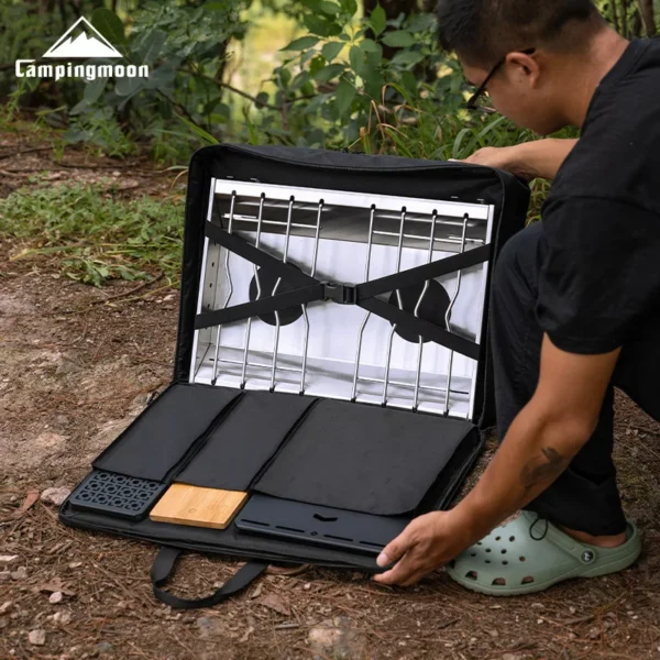 Black double unit gear container bag with two compartments packed with camp kitchen equipment