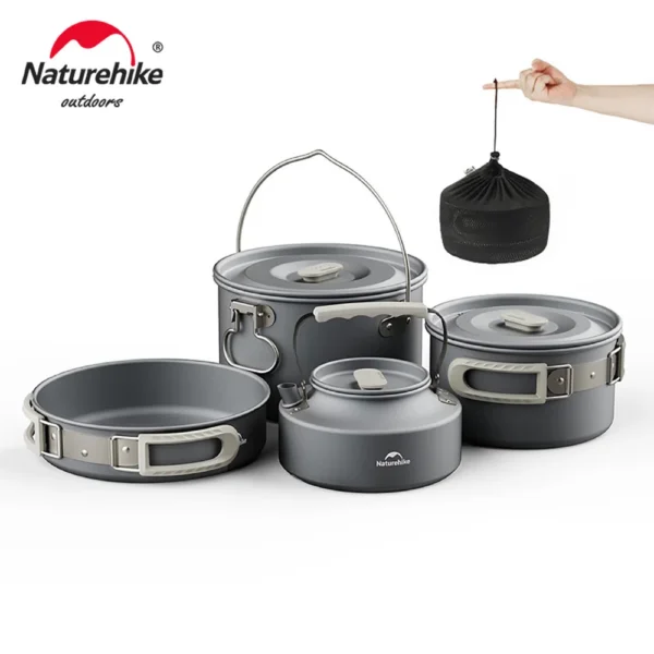 Naturehike group camping cookware set with frying pan, kettle and tableware on a camp table