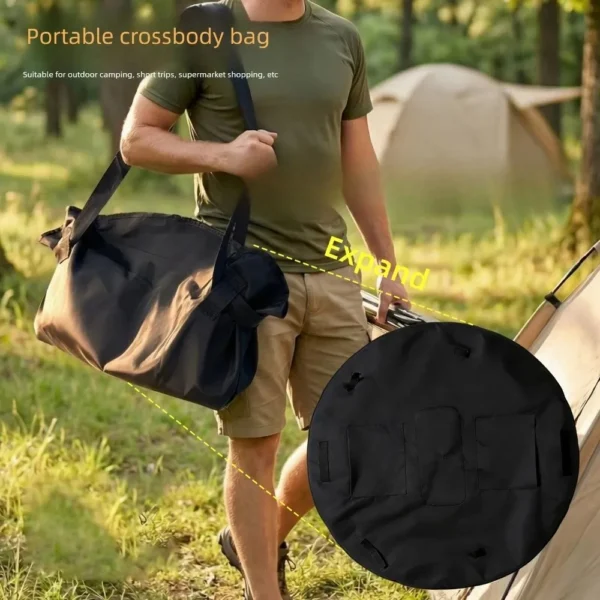 Black foldable travel duffel bag packed for a weekend trip beside a car