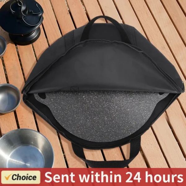 Black frying pan storage bag in 600D Oxford fabric with handle, holding a cast iron skillet
