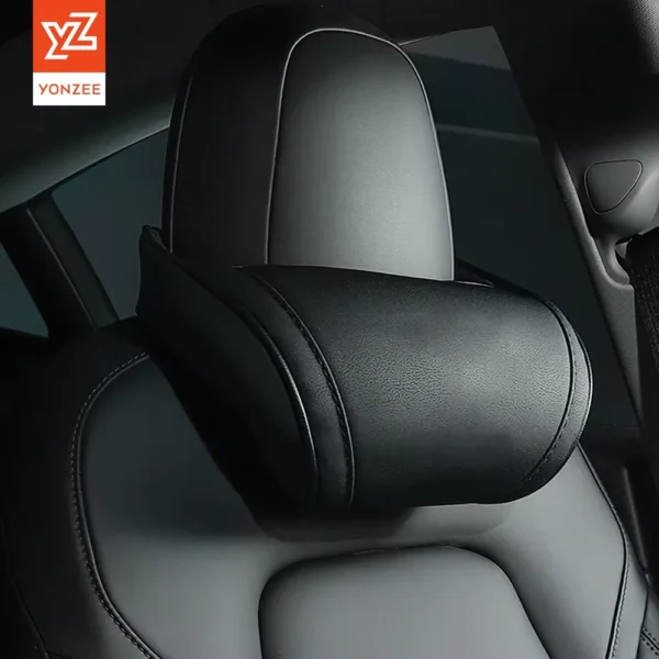 Car headrest neck pillow in white PU leather attached to a Tesla seat headrest