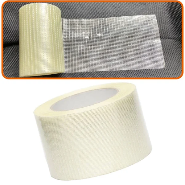 Roll of tent repair tape applied as an adhesive patch over a tear in a tent fabric wall