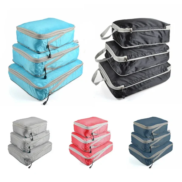 Foldable oxford packing cubes in navy blue with carry handles, shown filled and folded flat