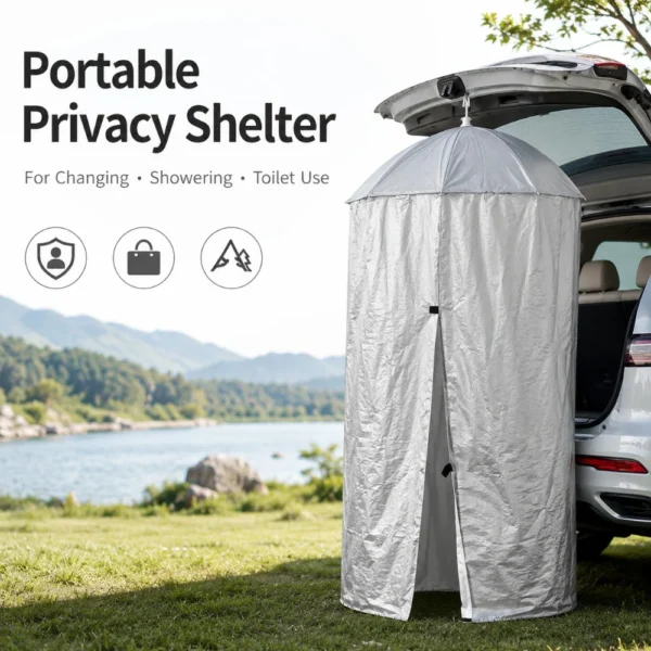 Car tailgate shower tent in silver hanging from the open rear door of an SUV
