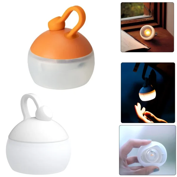 Mini retro camping lantern with warm glow hanging by its hook inside a tent