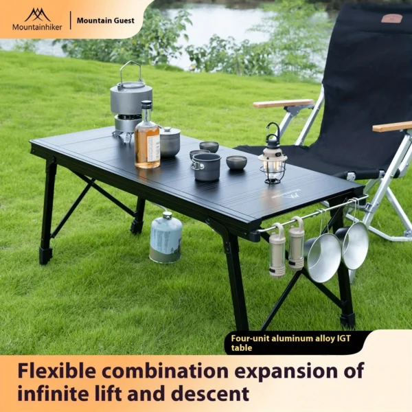 IGT camping lift table in folding aluminum alloy set up as an outdoor cooking station