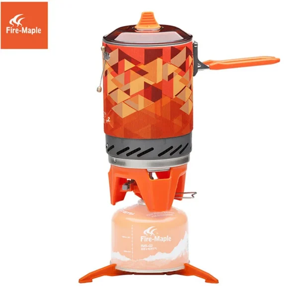 Fire-Maple X2 backpacking gas stove system in orange boiling water on a mountain trail