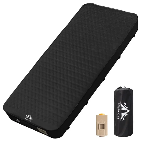 Black electric pump sleeping pad inflated in a tent showing its 4 inch foam thickness and built-in pump