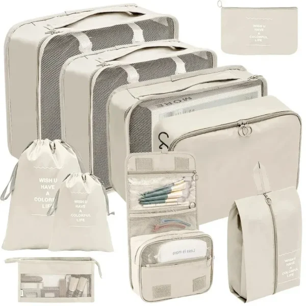 Shoe pouch packing cubes set in grey Oxford fabric arranged next to an open suitcase