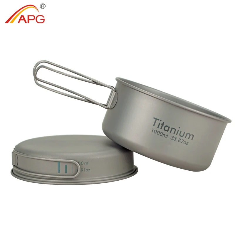 Folding Handle Titanium Pan Set With Saucepot and Plate Lid 1 Folding handle titanium pan set with saucepot and flipped lid used as a plate on a rock