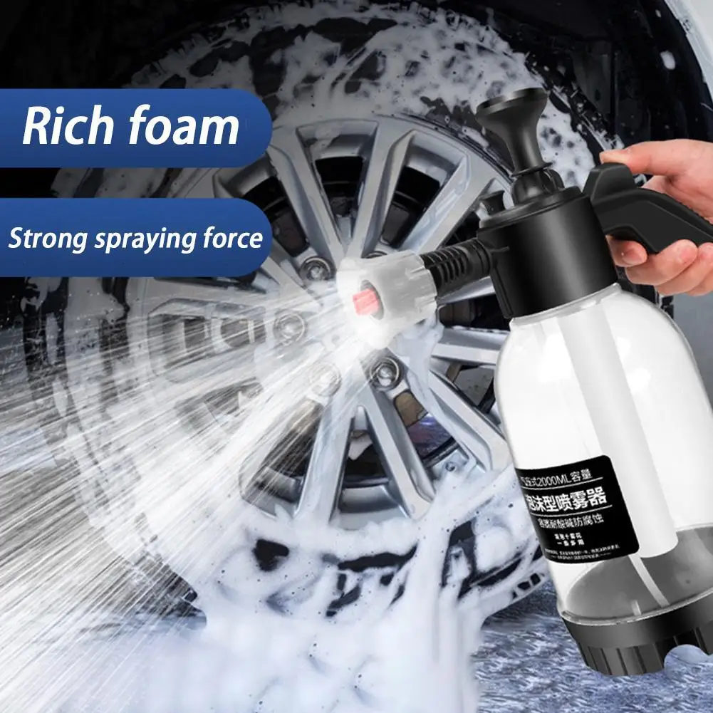 Car Wash Foam Sprayer 2L Handheld High Pressure Hand Pump 1 Car wash foam sprayer in black misting foam onto the side panel of a car