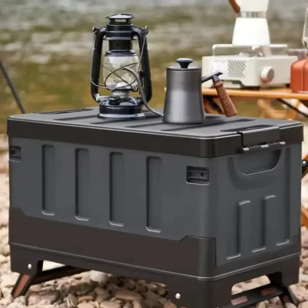Gray waterproof camping storage box with lid closed stacked in an SUV trunk